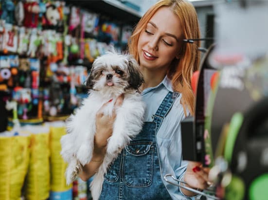 Woman and puppy at a pet store